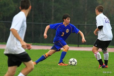 Tri-captain and sophomore midfield Ethan Kutler looks to move the ball through the Dryden defense to create a scoring chance in the Lansing’s defeat of Dryden. soccerv7i38 KutlerDryden3