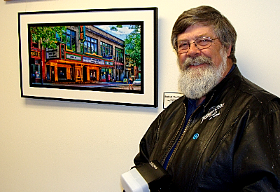 Monroe Payne with his photograph of the State Theatre The East Shore Festival Of The Arts