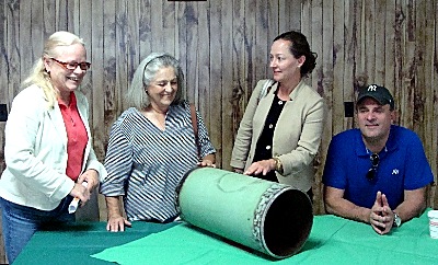Left to right: Dryden Town Supervisor Mary Ann Sumner, Lansing Town Supervisor Kathy Miller, Tompkins County Area Development Vice President & Director of Economic Development Services Heather Filiberto, Tompkins County Legislator Mike Sigler looking at a section of ten inch steel pipe that will make up the delivery pipeline gasline_pipe