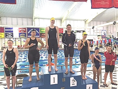 Paige Kieper #1, Rory Allen #4, Marin Allen #6 in the 100 Back swimi43 100BackPodiumPaigeKieper1RoryAllen4MarinAllen6