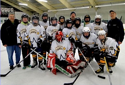 (Left to Right): Goalie Catie Eisenhut, Amy Milner, Sisi Stallman. Back Row: Assistant Coach Tony Eisenhut, Sofia Riccio, Mercedes Crawford, Nicole Nixon, Kelty Goodrow, Kiely Howe, Dori Shipman, Assistant Coach John Goodrow, Elizabeth Talty, Reed Baker, Charlotte Rowe, Head Coach Eric Eisenhut. Photo by Helen Talty hockey shootingstars 20150121