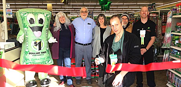 Left to right: Bucky-Amanda Seymour, Tompkins County Legislator Deborah Dawson, Village of Lansing Deputy Mayor Ronny Hardaway, Town of Lansing Councilwoman Katrina Binkewicz, Matthew Binkewicz, District Manager Joseph Emery, and store managerRobert McDowell cutting the ribbon dollartree grandopening