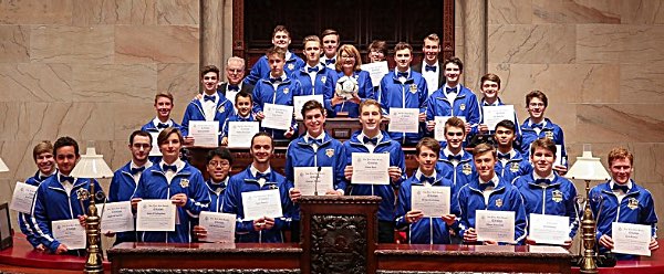 Senator Pam Helming stands with members of the Lansing High School Bobcats boys soccer team that won the 2018 New York State Public High School Athletic Association Championship, the team's second straight Class C state title. Joining in the celebration in the State Senate chamber were Head Coach Benji Parkes, his coaching staff, and the 28 players. helming Lansing Boys Soccer