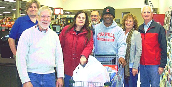 Left to right: Wil Buttner (Dryden Rotary Club), Ed Siemon, Kathryn Mapes, Dennis Osika, Willie Evans,(winner) Ronna Anthony (his partner), and Don Wells. rotary grocerycart