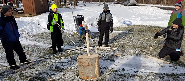 Scouts from Ithaca’s Troop 4 – winners of this year’s Winter Camporee - working as a team to cut a tree without touching the saw scouts 20190126 095102