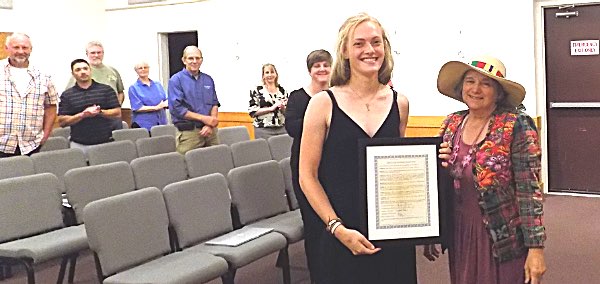 Ellen Howell receives framed resolution from Lansing Councilwoman Andra Benson Ellen Howell